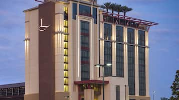 Stunning hotel building with a striking vertical design, featuring large windows and a unique metal framework.