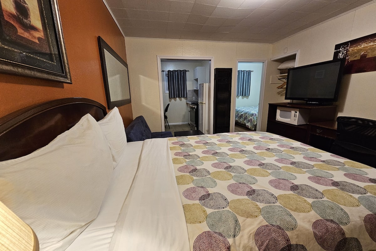 Deluxe Room, Kitchenette (Two Queen Beds) | Desk, blackout drapes, iron/ironing board, free WiFi