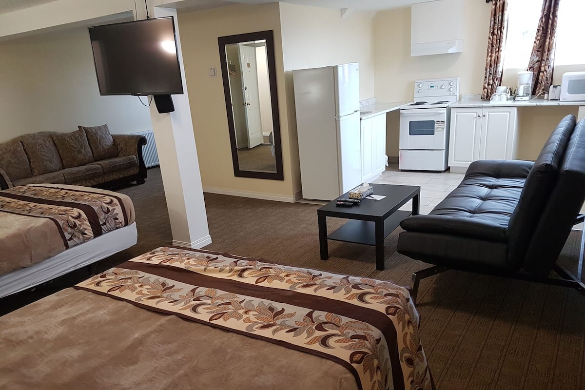 Family Room | Desk, blackout drapes, iron/ironing board, free WiFi