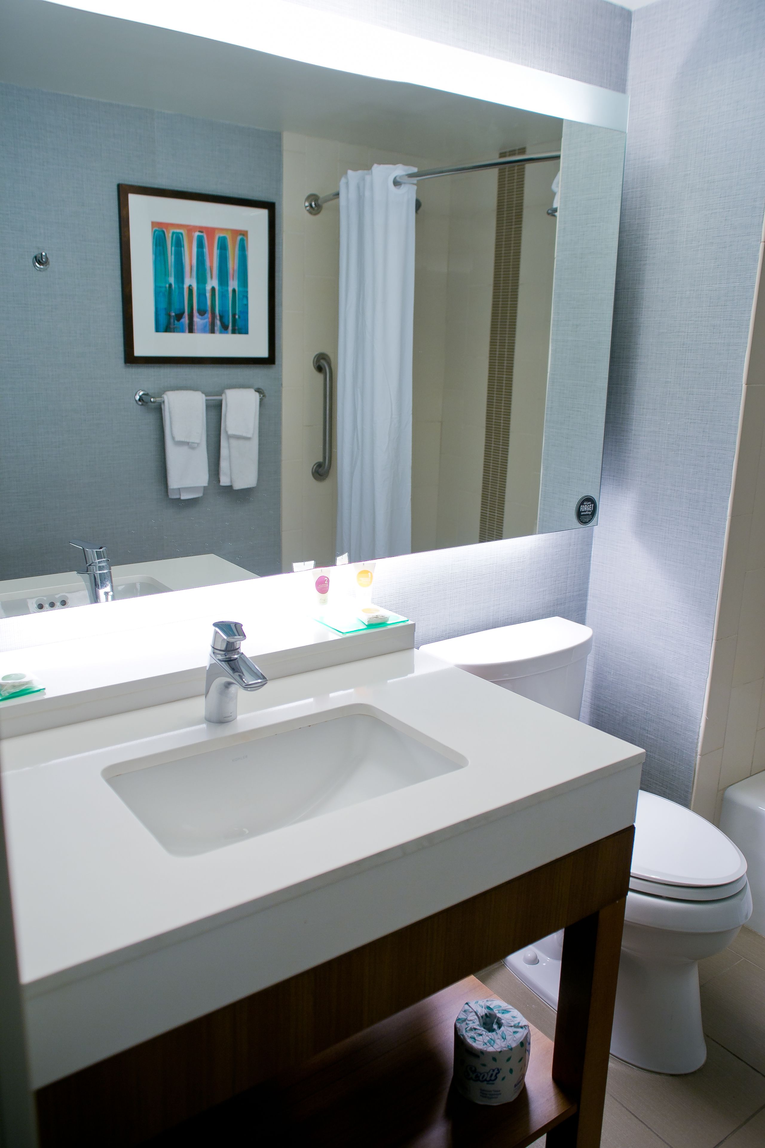 designer toiletries, hair dryer, towels, soap