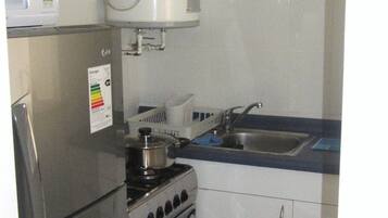 Standard Apartment (304) | Private kitchen | Full-sized fridge, microwave, cookware/dishes/utensils