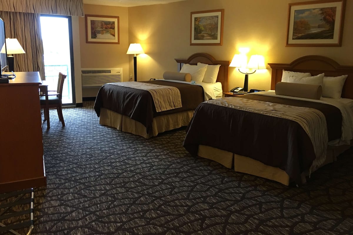 Standard Room, 2 Queen Beds, Non Smoking, Jetted Tub (Oversized Room) | Desk, laptop workspace, blackout drapes, iron/ironing board