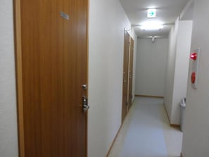 Corridors lead to rooms with a door at the end.