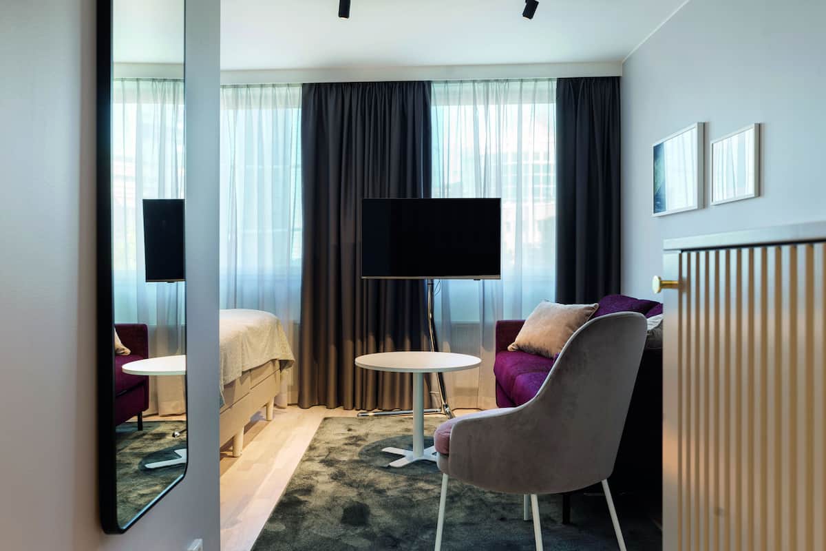 deluxe room | living area | tv