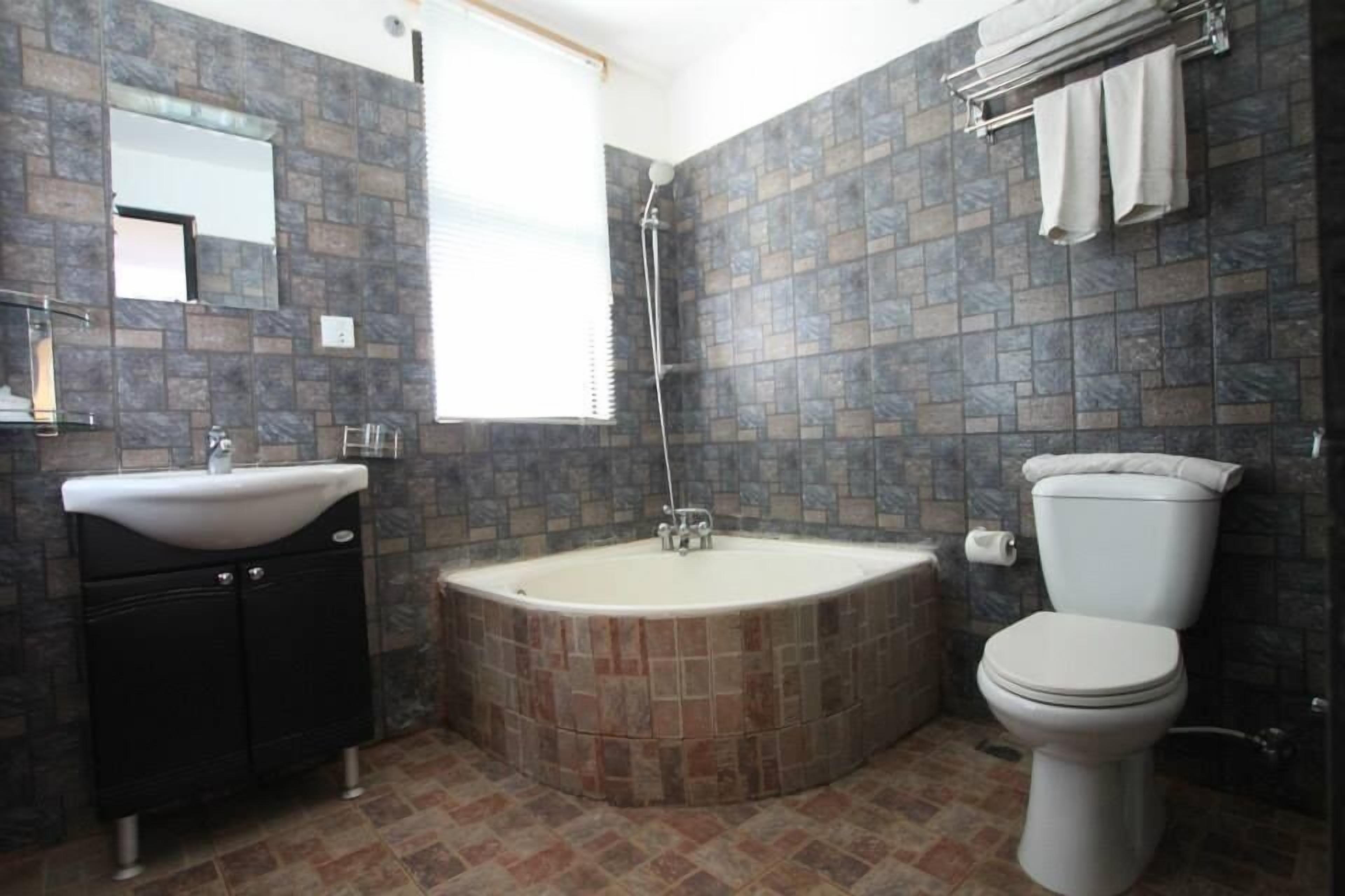 shower, rainfall showerhead, slippers, towels