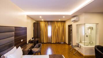 Grand Room, 1 King Bed, City View | In-room safe, desk, iron/ironing board, free cribs/infant beds