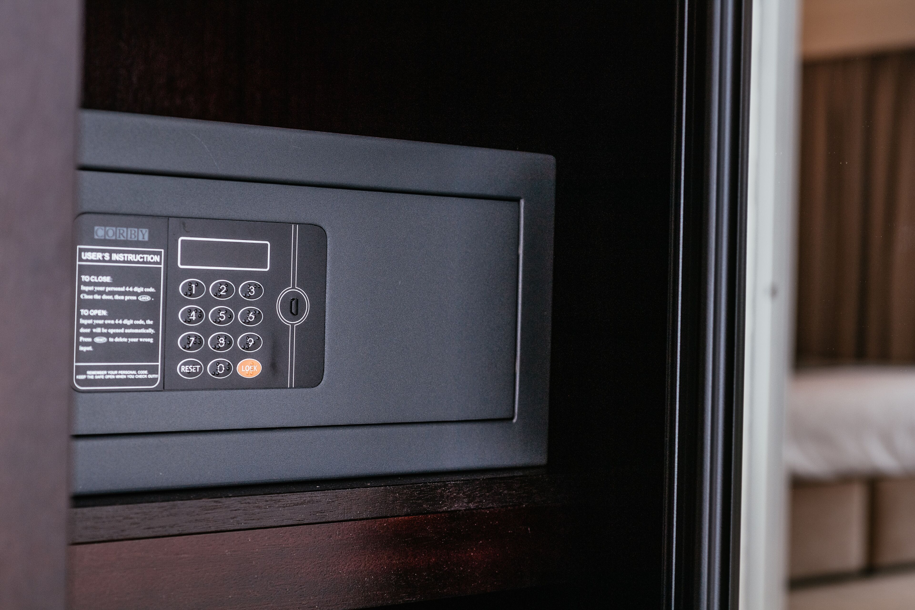 A close-up of a microwave with a control panel, including a keypad and a digital display.