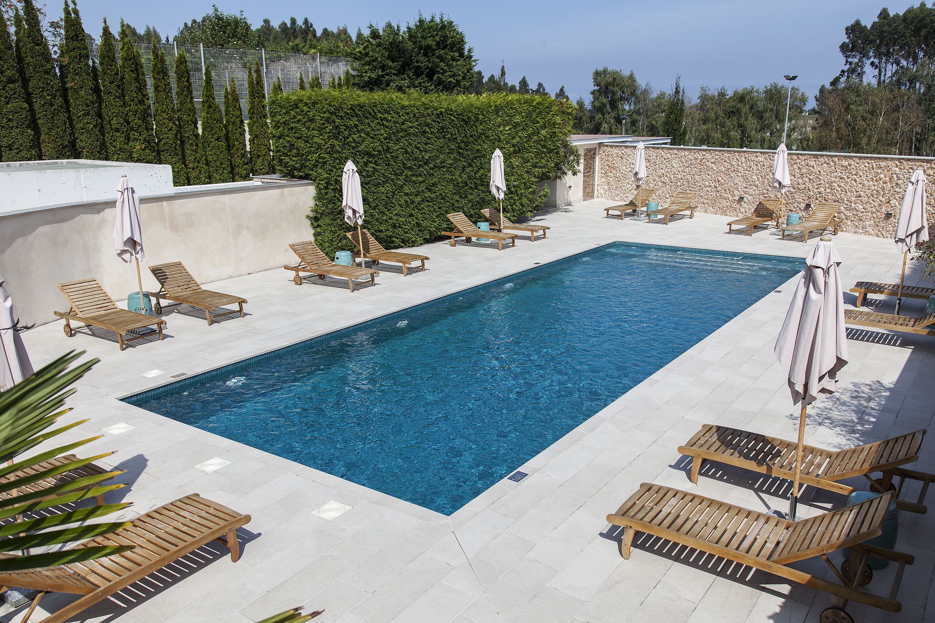 seasonal outdoor pool, pool umbrellas, pool loungers