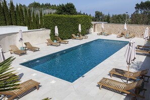 Seasonal outdoor pool, pool umbrellas, pool loungers