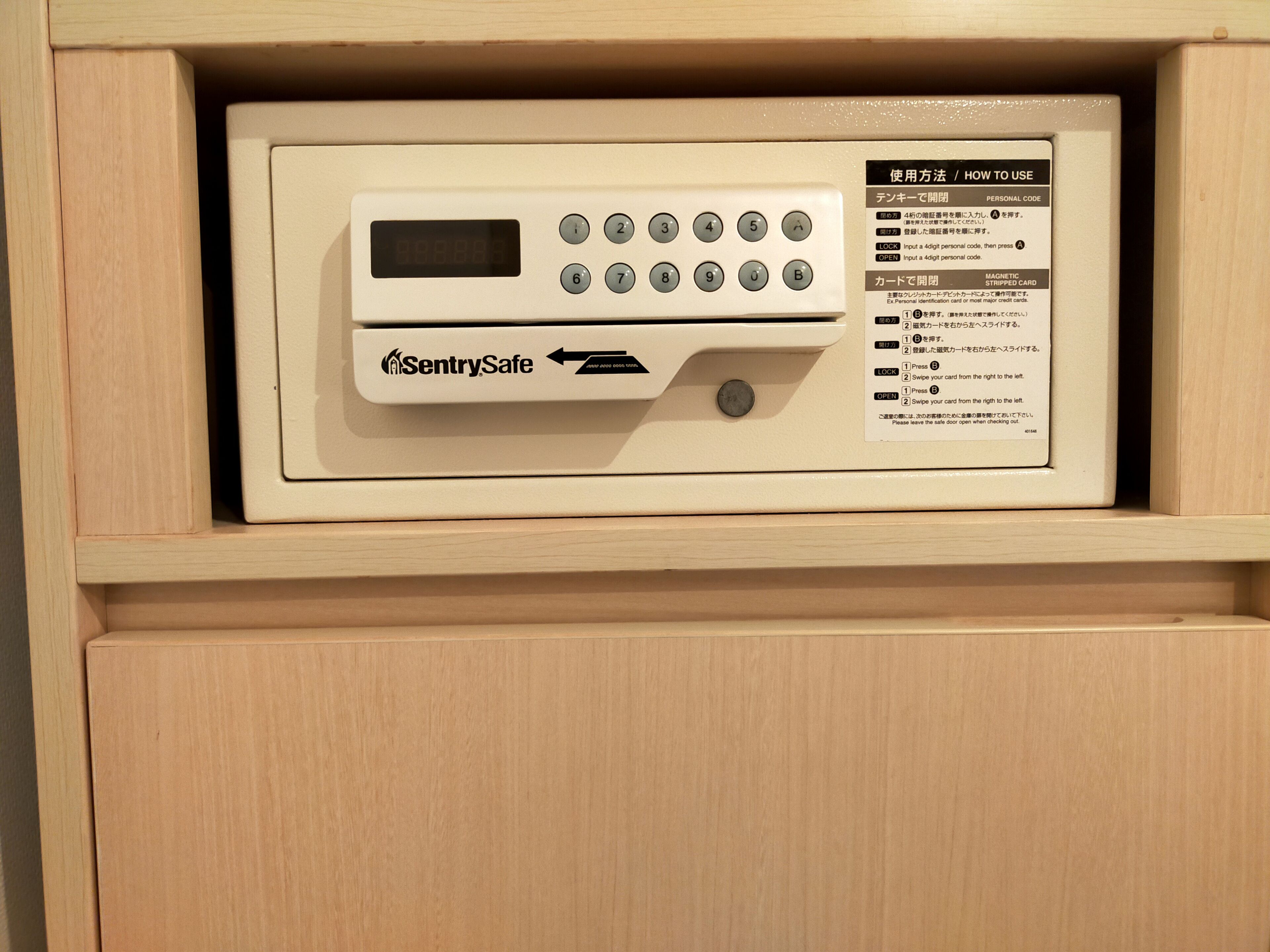 A SentrySafe safe in a wooden cabinet.