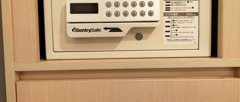 A SentrySafe safe in a wooden cabinet.