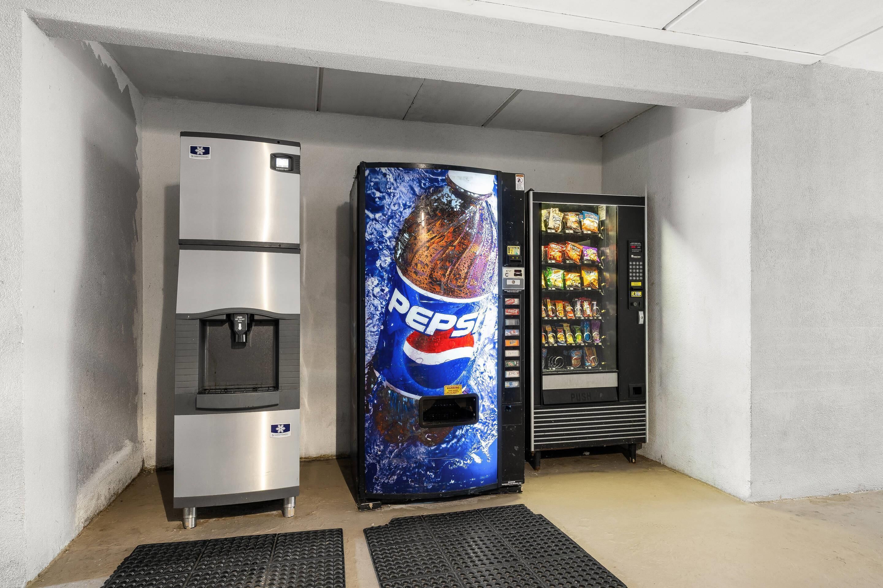 A vending machine with a Pepsi logo, a water dispenser, and a snack vending machine.