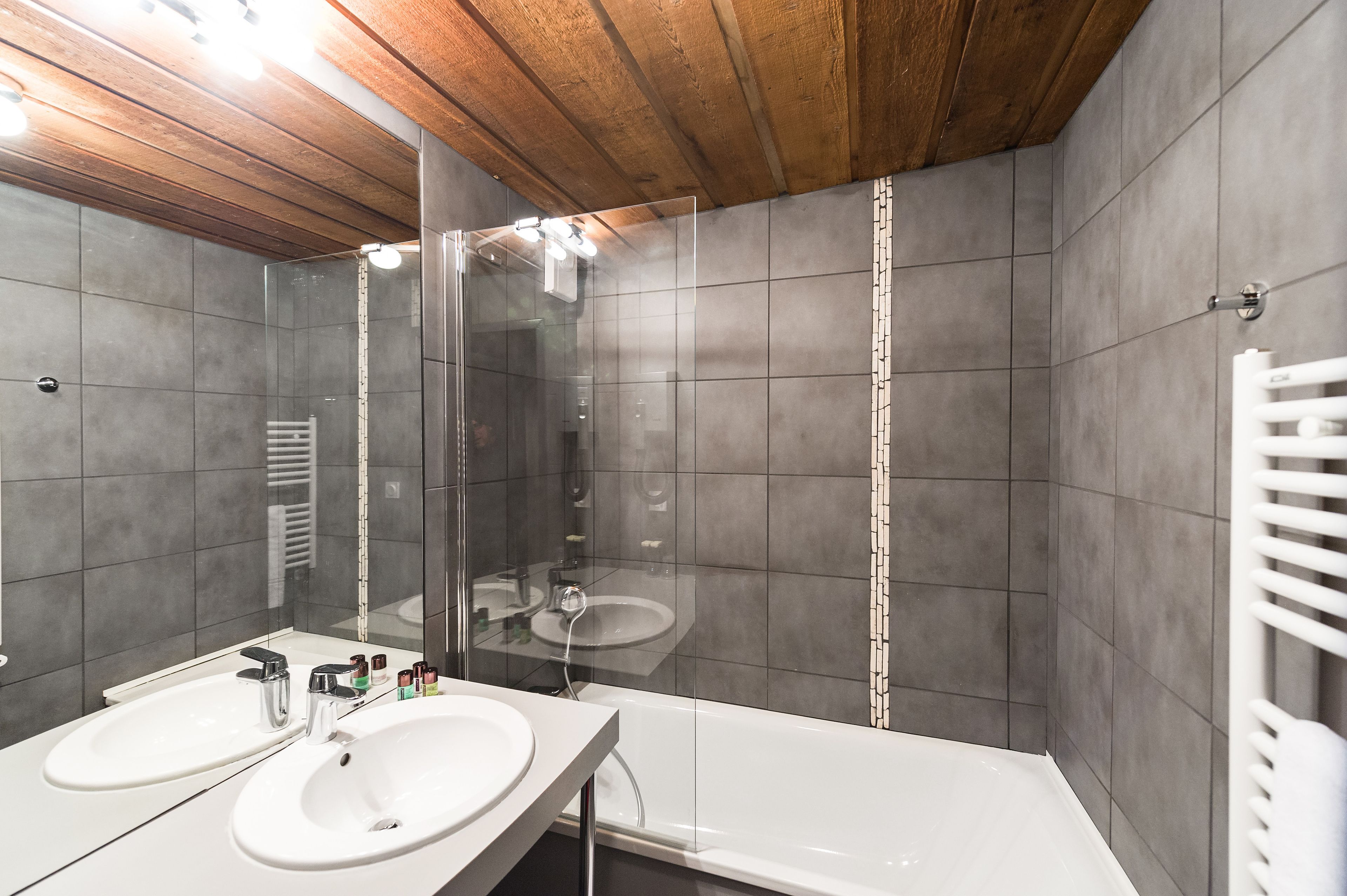 bathtub, free toiletries, hair dryer, towels