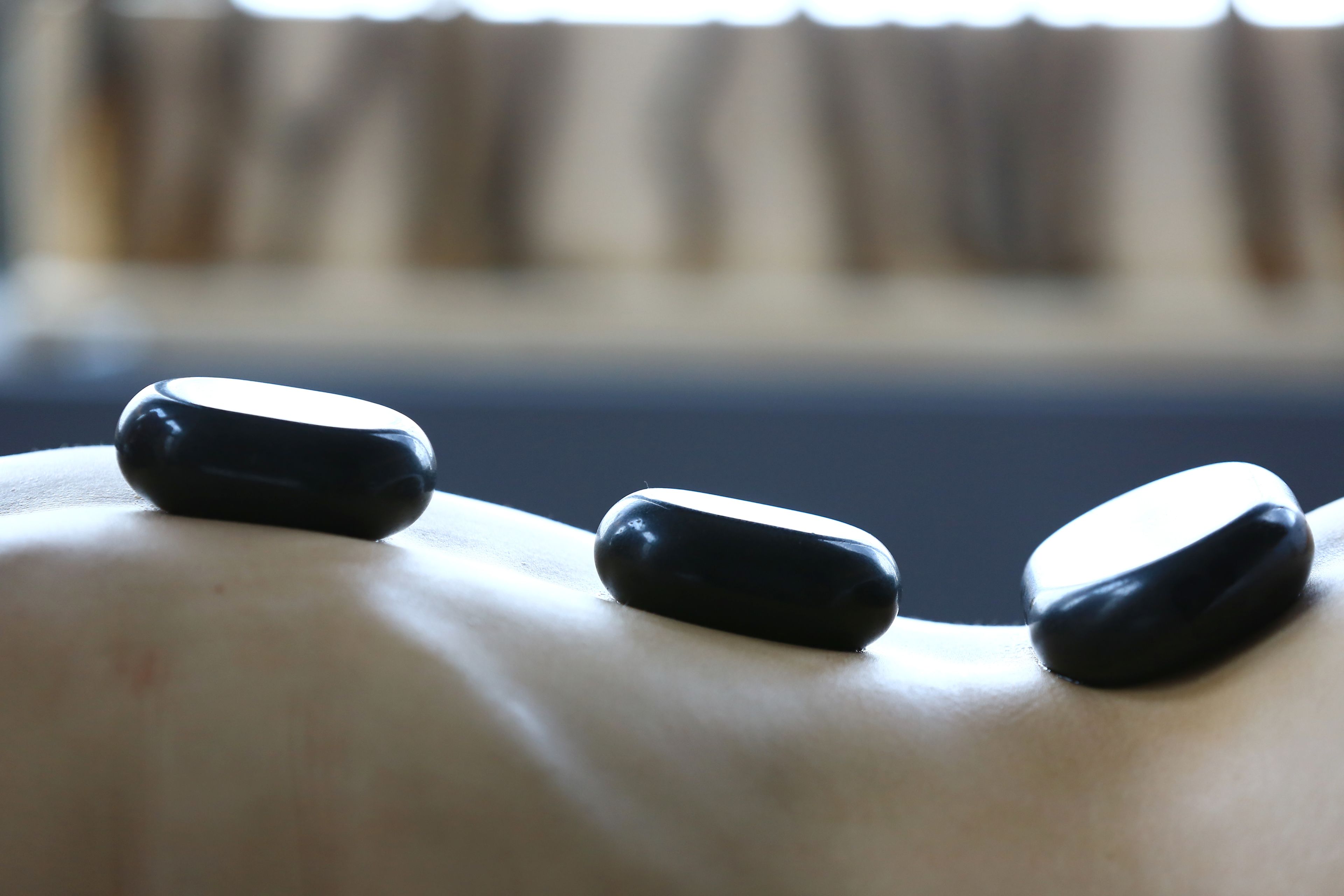 A close-up of three black objects on a surface.