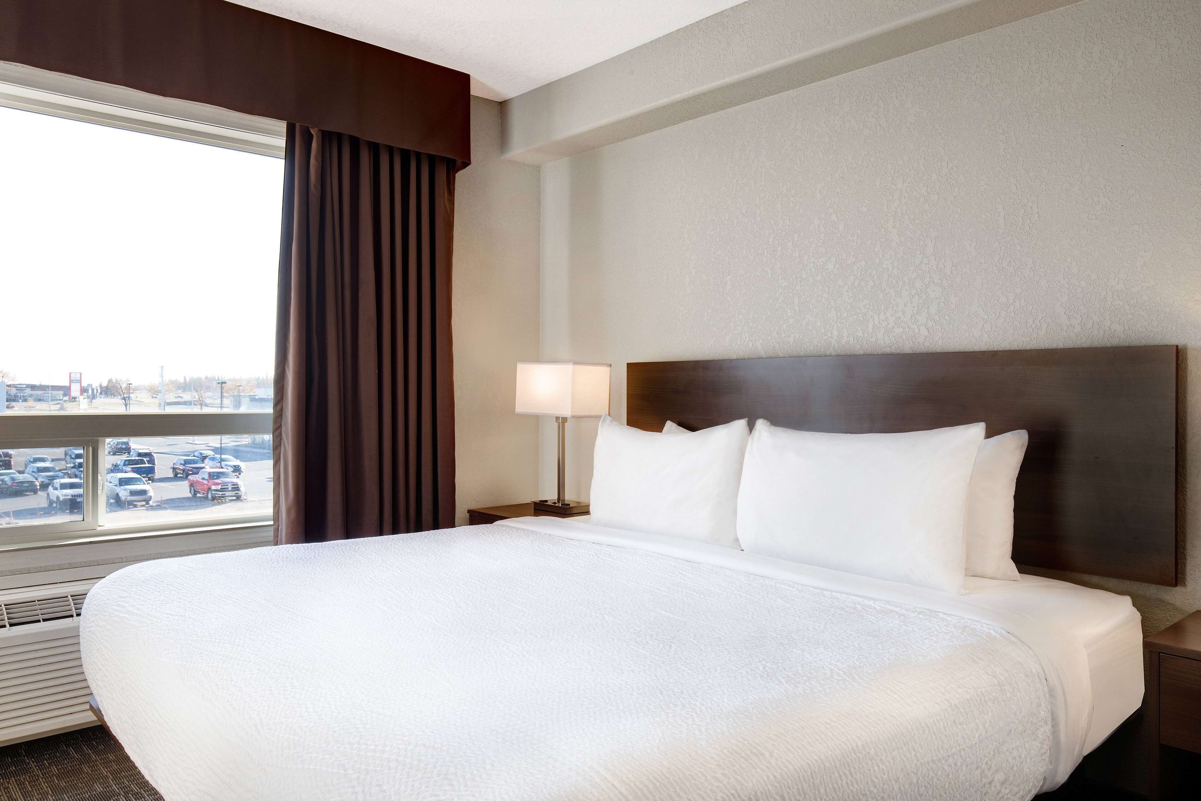 desk, laptop workspace, blackout curtains, iron/ironing board