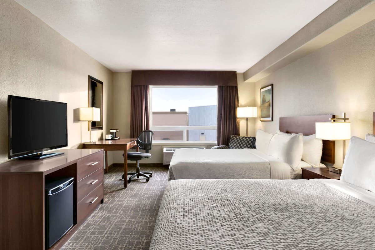 deluxe room, 2 queen beds, non smoking | desk, laptop workspace, blackout curtains, iron/ironing board