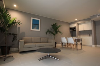 Suite | Living room | 50-inch Smart TV with cable channels, TV at Polynesian Residences Waikiki Beach