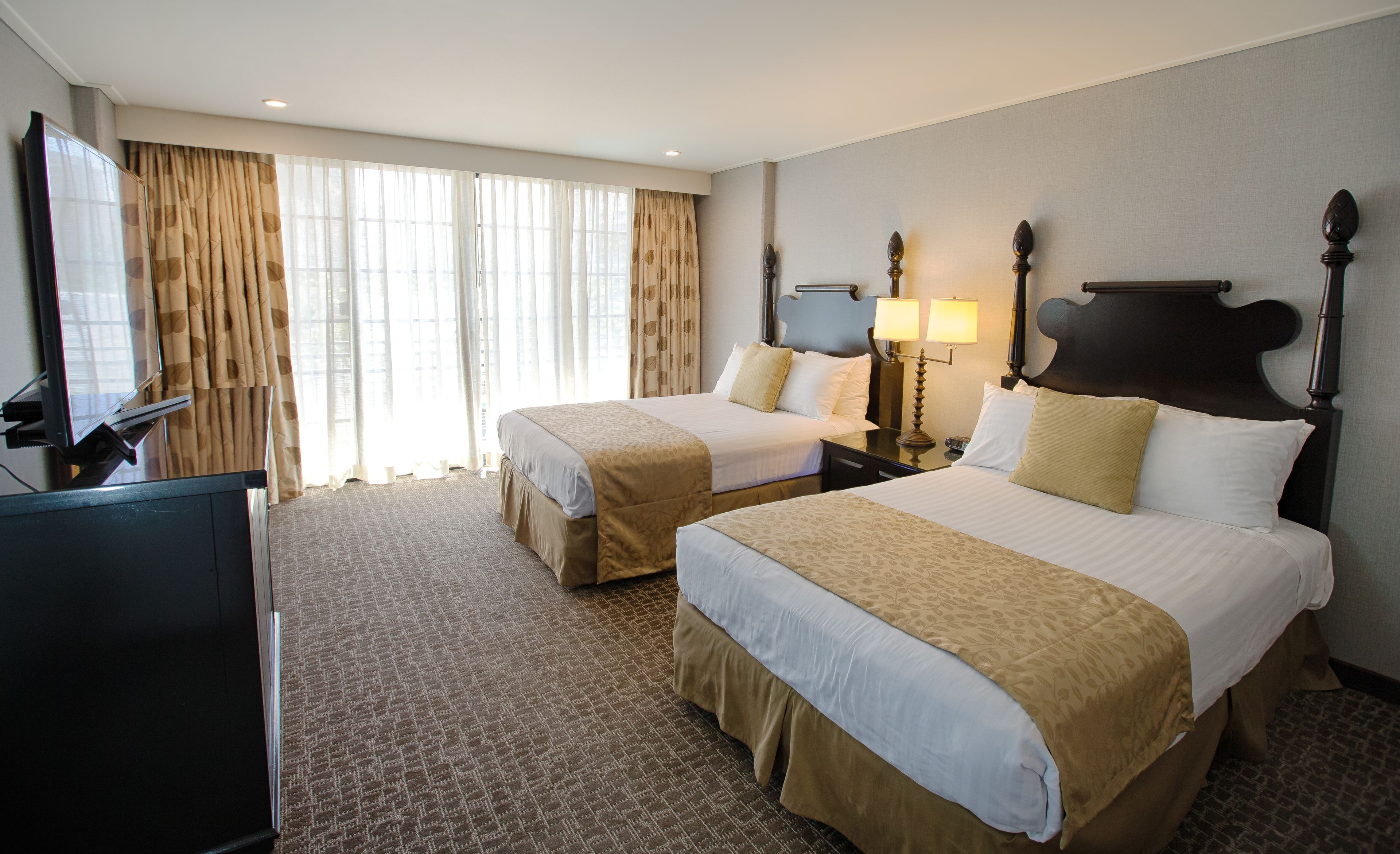 deluxe room, 2 double beds | in-room safe, desk, soundproofing, iron/ironing board