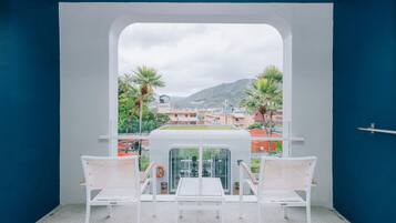 Deluxe Room, Pool View | Balcony view