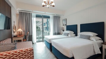Deluxe Room, Pool View | In-room safe, individually decorated, desk, laptop workspace