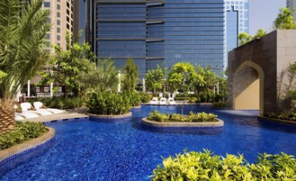 Outdoor pool, open 7:00 AM to 8:00 PM, pool cabanas (surcharge)