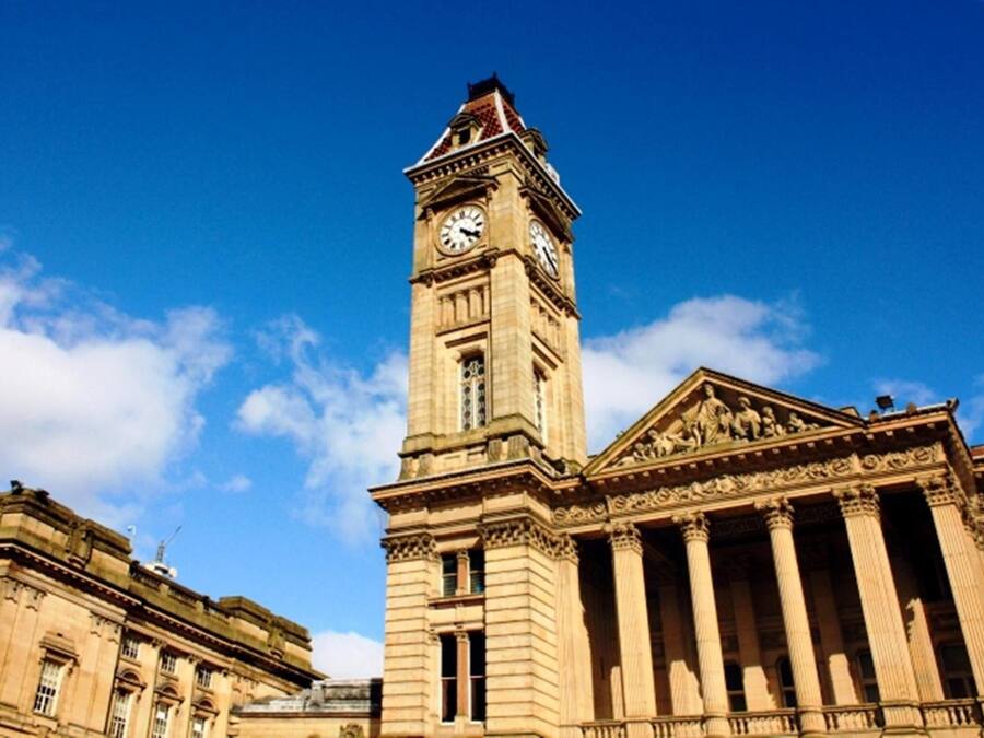 A historic building with a prominent clock tower and classical architecture.
