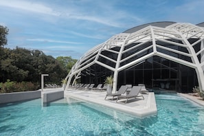 Indoor pool, seasonal outdoor pool, pool umbrellas, pool loungers