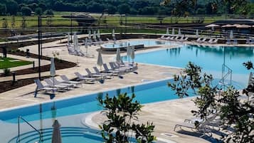 Indoor pool, seasonal outdoor pool, pool umbrellas, pool loungers