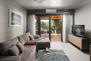 Beach Villa | Living area | 56-cm flat-screen TV with satellite channels, LCD TV, ping pong