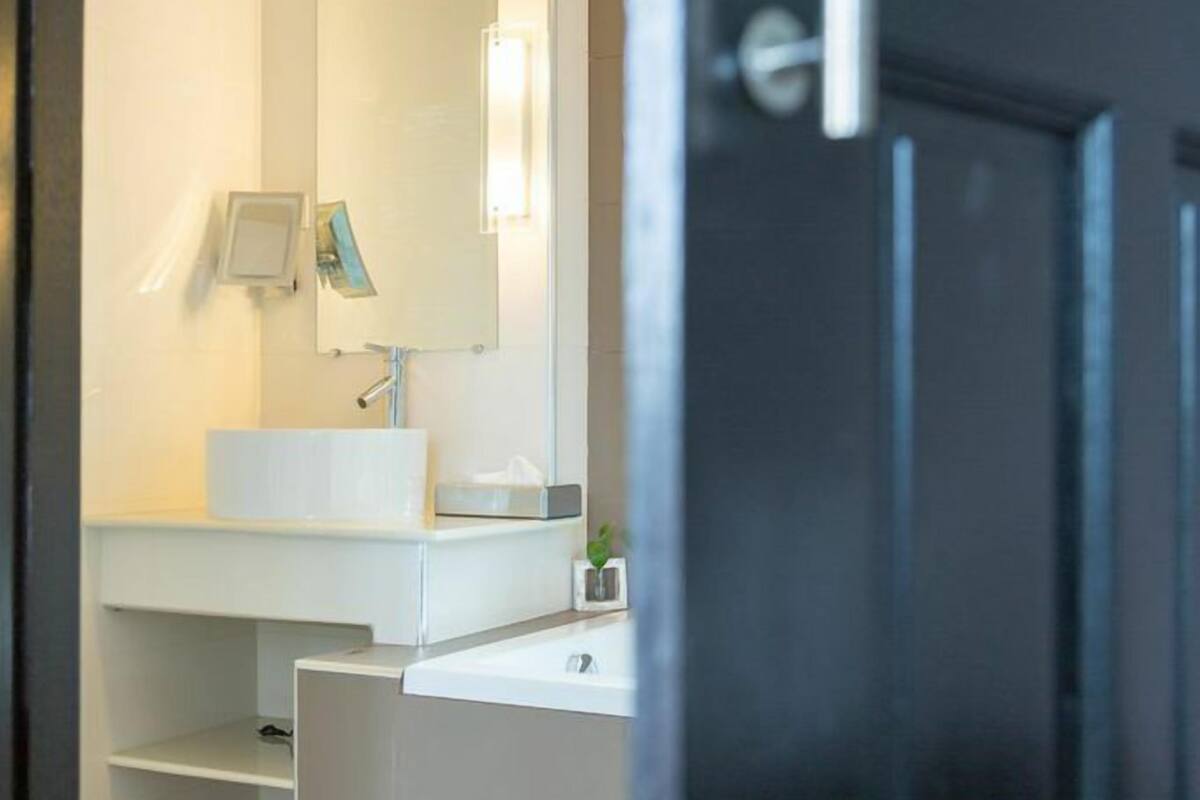 standard double room | bathroom | separate bathtub and shower, jetted bath, rainfall showerhead