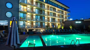 Seasonal outdoor pool, open 9:00 AM to 9:00 PM, pool umbrellas