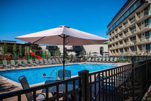 Seasonal outdoor pool, open 9:00 AM to 9:00 PM, pool umbrellas