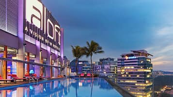Outdoor pool, open 6:00 AM to 11:00 PM, pool umbrellas, sun loungers