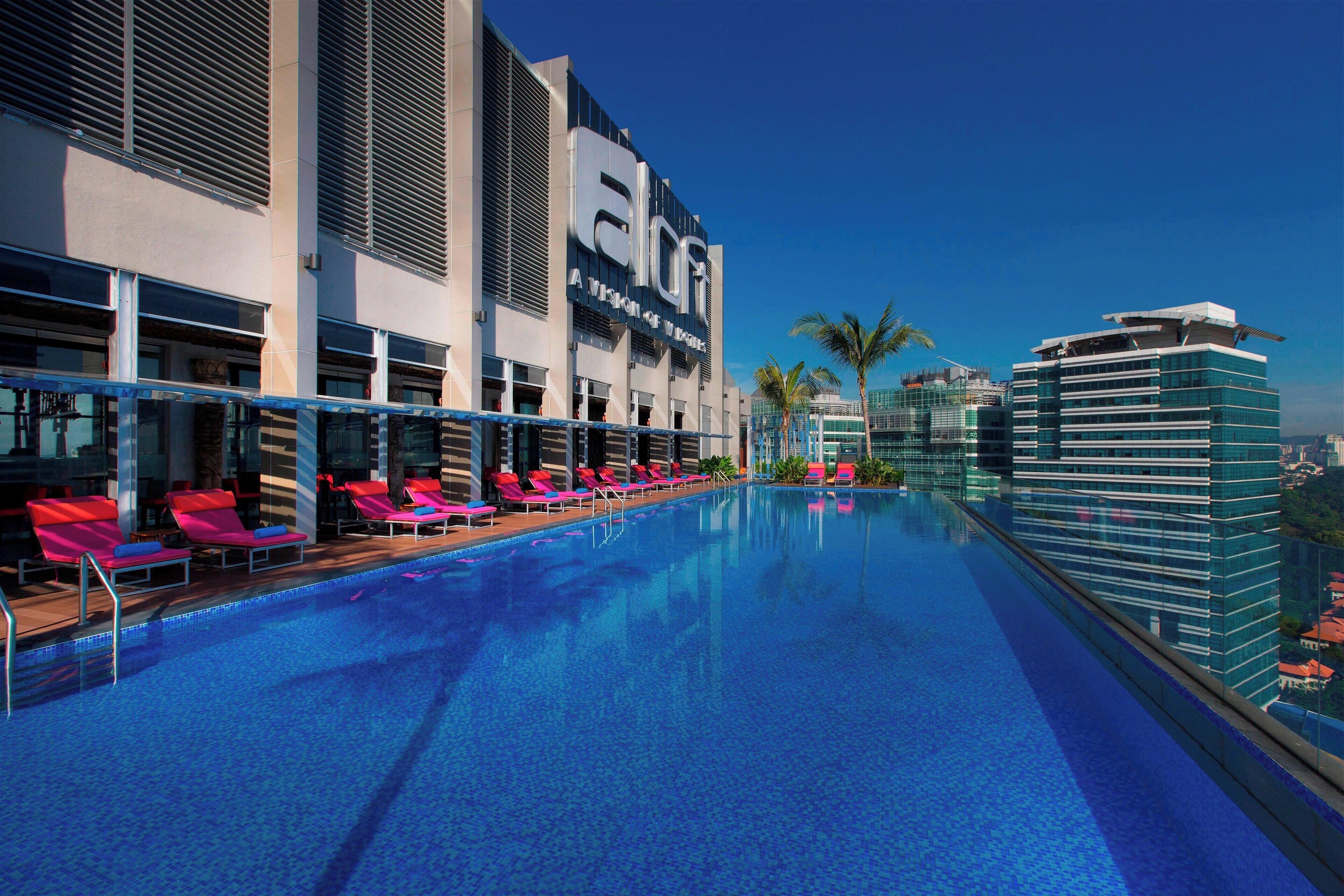 outdoor pool, open 6:00 am to 11:00 pm, pool umbrellas, pool loungers