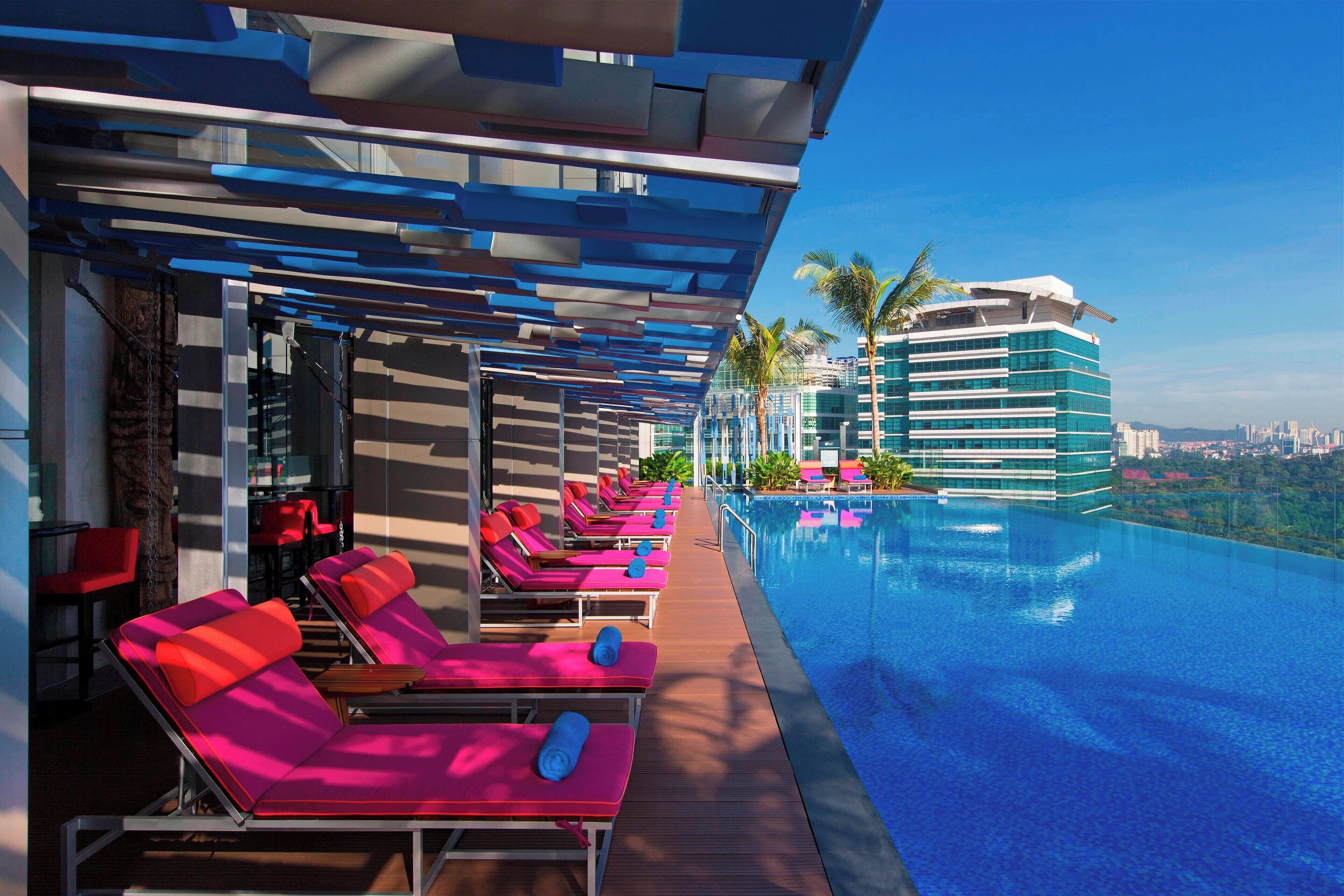 outdoor pool, open 6:00 am to 11:00 pm, pool umbrellas, pool loungers