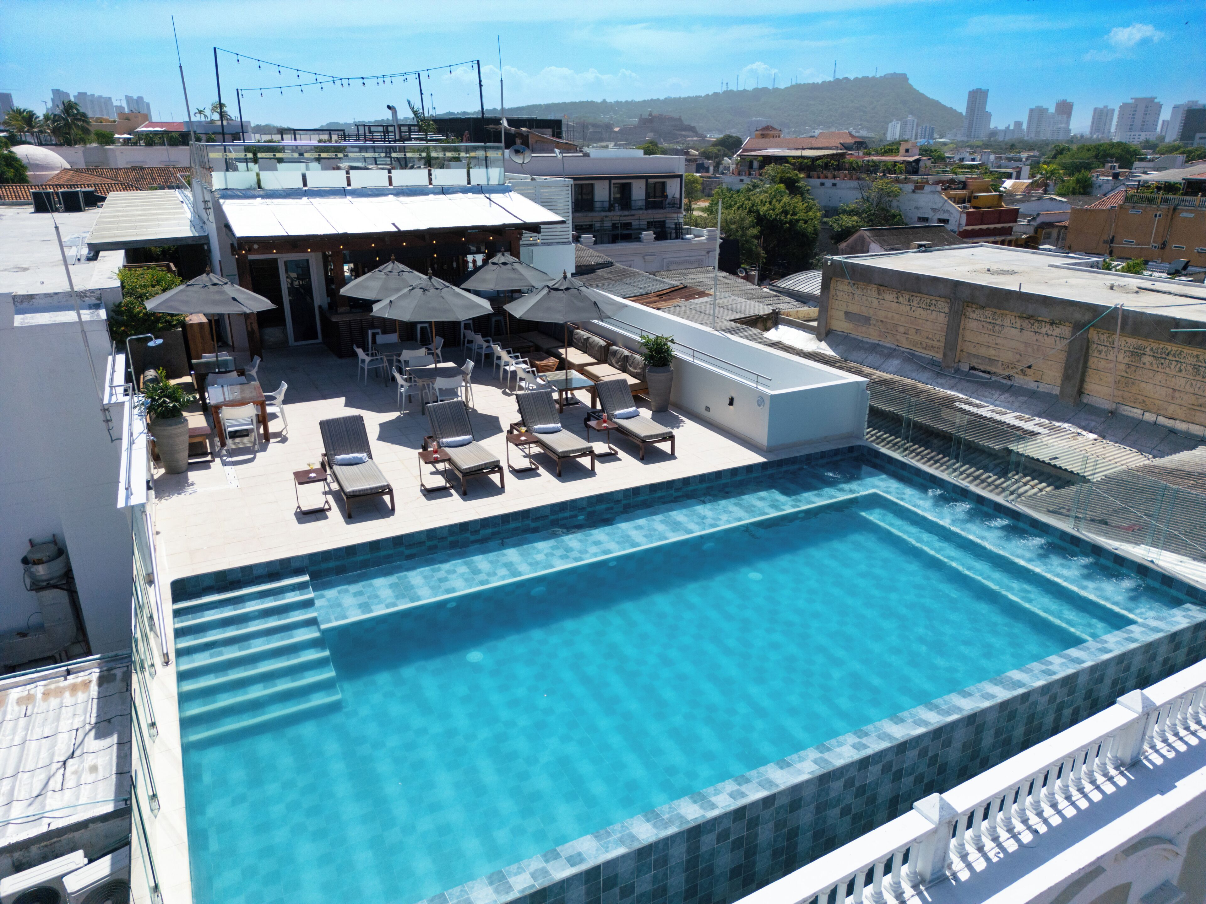 Outdoor pool, pool umbrellas, sun loungers