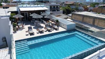 Outdoor pool, pool umbrellas, sun loungers