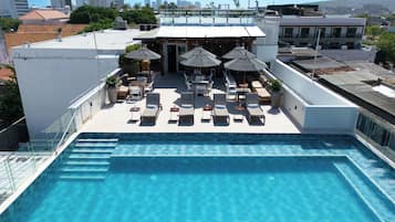 Outdoor pool, pool umbrellas, sun loungers