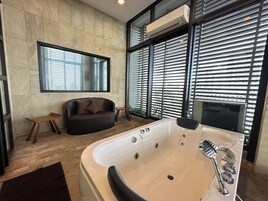 LUXENT SUITE | Bathroom | Hydromassage showerhead, free toiletries, hair dryer, bathrobes