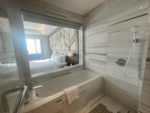 Club - King | Bathroom | Hydromassage showerhead, free toiletries, hair dryer, bathrobes - Luxent Hotel (Quezon City)