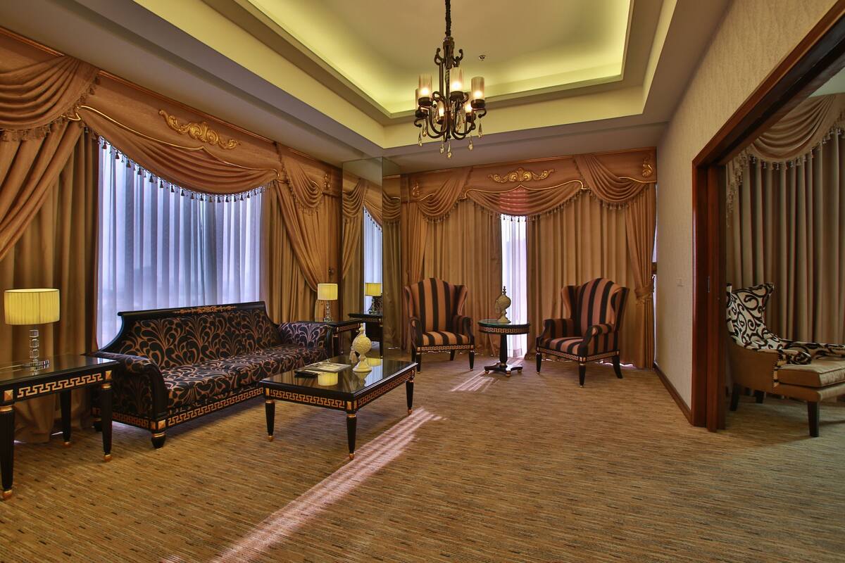 LUXENT SUITE | Living room | 46-inch LED TV with cable channels, table tennis