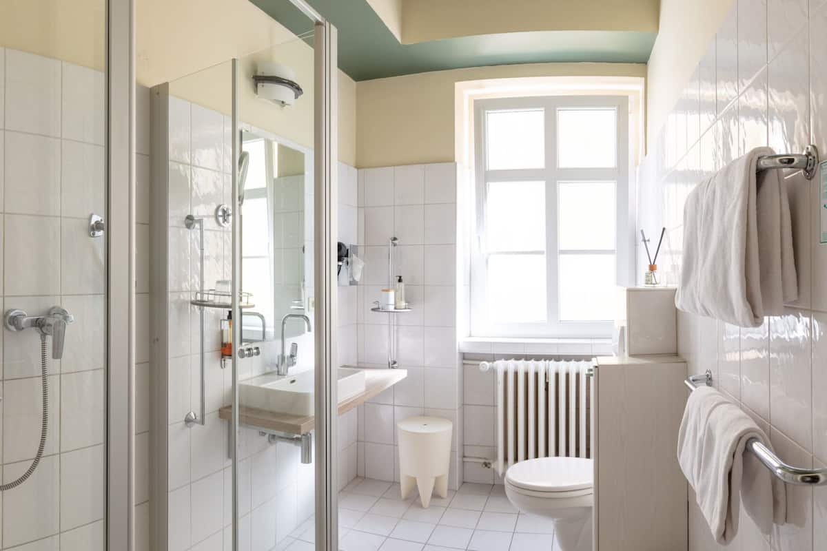 superior double room | bathroom | free toiletries, hair dryer, slippers, towels