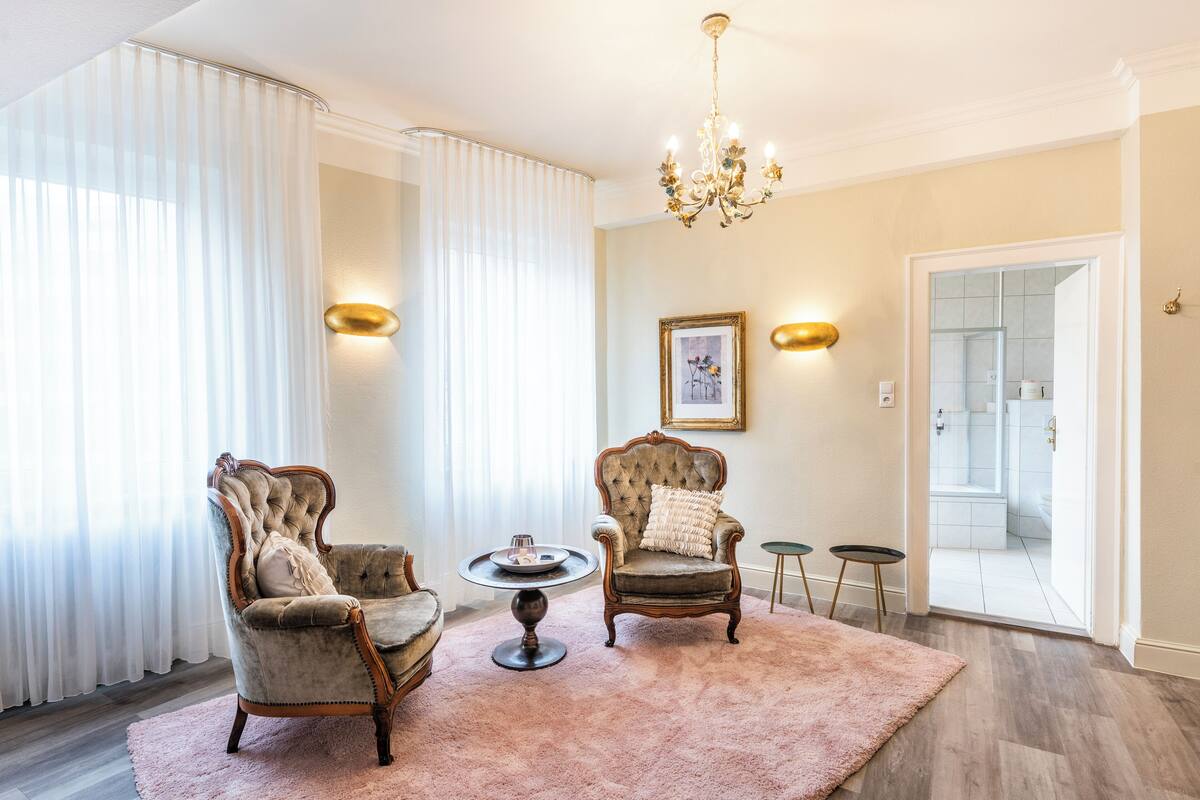 superior double room | living area | flat-screen tv