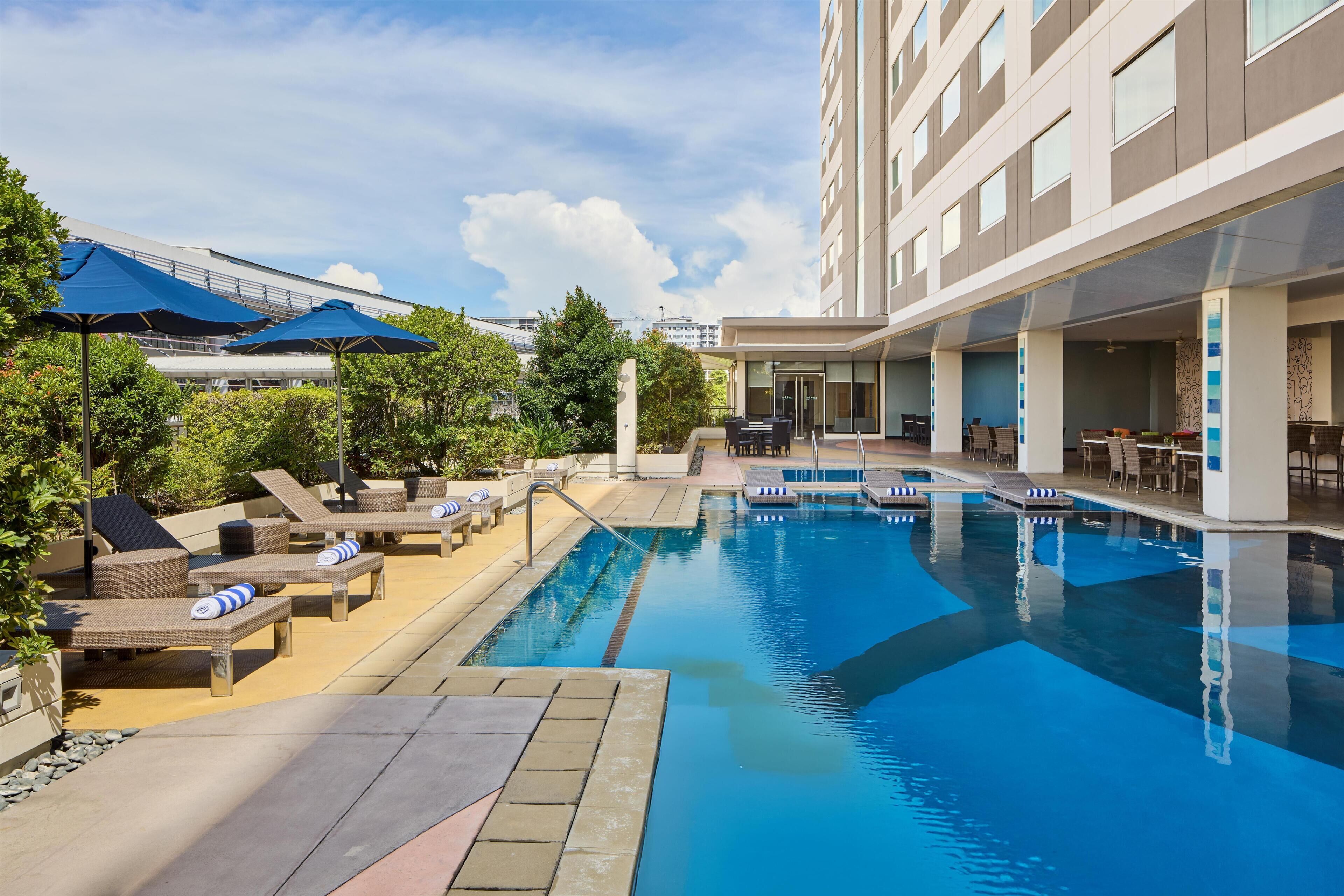Outdoor pool, open 10:30 AM to 5:30 PM, pool umbrellas, sun loungers