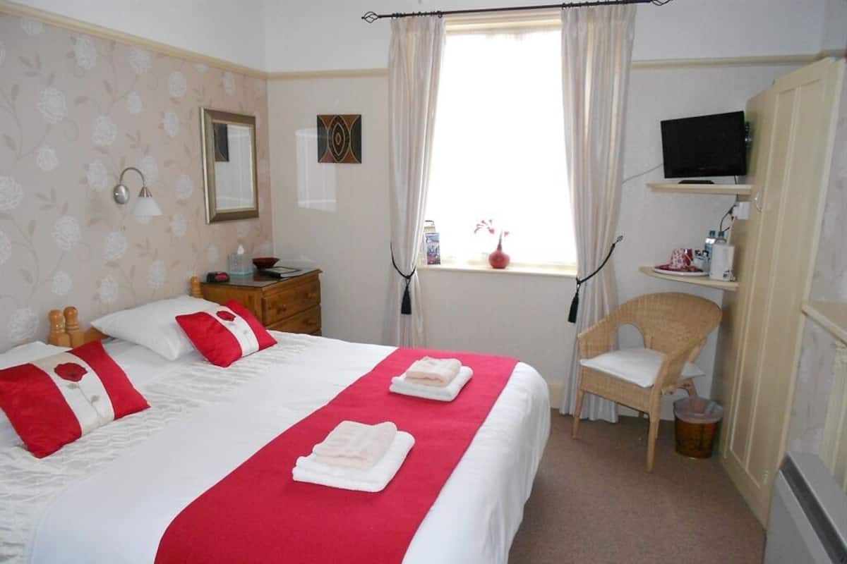 Kamer, 1 twee- of 2 eenpersoonsbedden, en-suite badkamer | 1 slaapkamer
