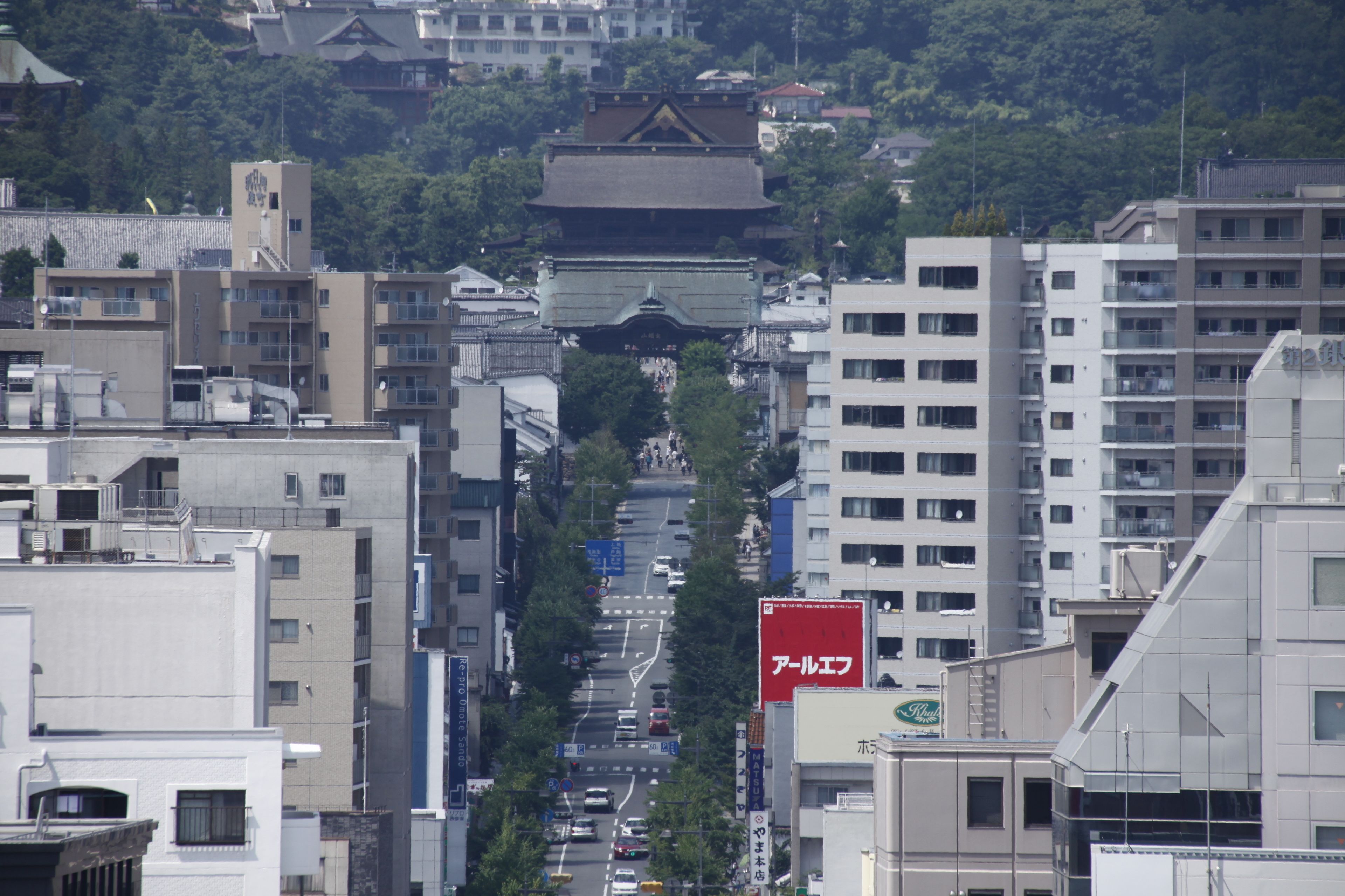 A city street with traditional architecture and modern buildings.