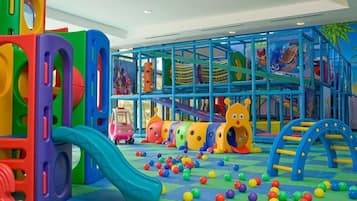 Children can play and climb on the slides, tunnels, and climbing frames in this enclosed play area.