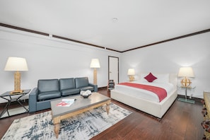 Queen Studio | Living area | 42-inch plasma TV with cable channels, TV, iPod dock