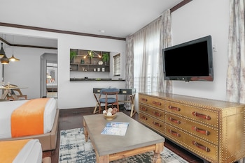 Double Queen Studio | Living area | 42-inch plasma TV with cable channels, TV, iPod dock at Lincoln Arms Suites