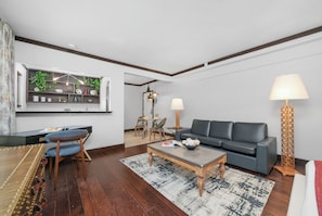 Studio Suite | Living area | 42-inch plasma TV with cable channels, TV, iPod dock